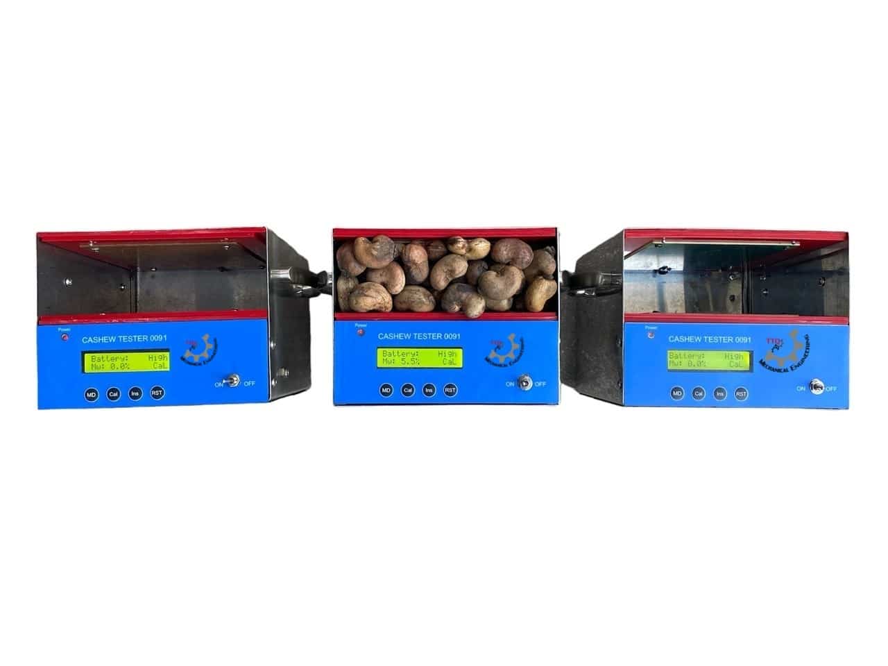 Three CASHEW TESTER 0091 units, the middle one loaded with raw nuts and reading 5.5%